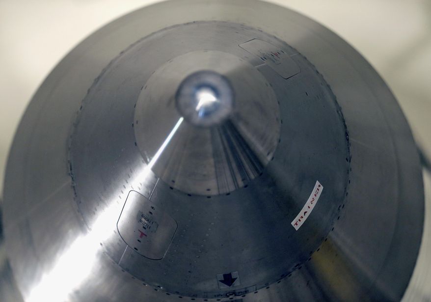 In this photo taken June 25, 2014, the warhead-containing nose cone of an inert Minuteman 3 missile is seen in a training launch tube at Minot Air Force Base, N.D. The base is tasked with maintaining 150 of the nuclear-tipped missiles spread out across the North Dakota countryside and keeping them ready to launch at a moment&#39;s notice as part of the U.S.&#39;s nuclear defense strategy. (AP Photo/Charlie Riedel)