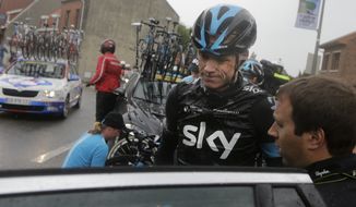 Britain&#39;s Christopher Froome gets into his team car after abandoning the race following a third consecutive crash in two days during the fifth stage of the Tour de France cycling race over 155 kilometers (96.3 miles) with start in Ypres, Belgium, and finish in Arenberg, France, Wednesday, July 9, 2014. The stage initially contained nine sectors of cobblestone roads dreaded by the majority of the riders in the pack especially under wet conditions, the organization decided to cancel two of the nine stretches because of the weather. (AP Photo/Laurent Cipriani)