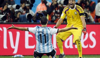 Argentina&#x27;s Maxi Rodriguez, left, celebrates with goalkeeper Sergio Romero after scoring the decisive goal during the World Cup semifinal soccer match between the Netherlands and Argentina at the Itaquerao Stadium in Sao Paulo, Brazil, Wednesday, July 9, 2014. Argentina beat the Netherlands 4-2 in a penalty shootout to reach the World Cup final. (AP Photo/Frank Augstein)