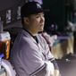 New York Yankees starting pitcher Masahiro Tanaka watches from the dugout after leaving the game in the seventh inning of a baseball game against the Cleveland Indians Tuesday, July 8, 2014, in Cleveland. Tanaka pitched 6 2/3 innings and gave up 10 hits and five runs. (AP Photo/Tony Dejak)