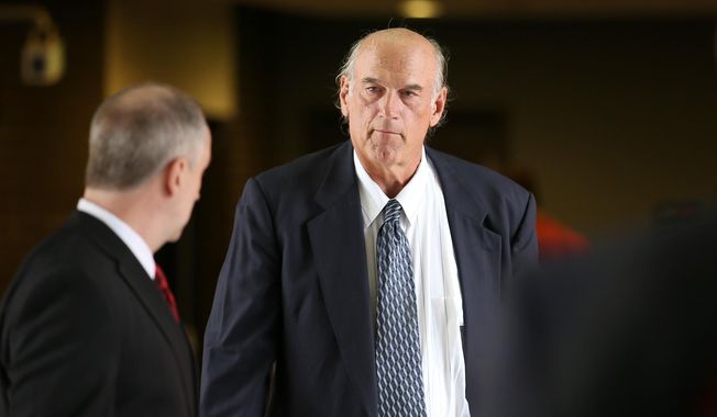 ** FILE ** Former Minnesota Gov. Jesse Ventura, right, made his way back into Warren E. Burger Federal Building during the first day of jury selection in a defamation lawsuit, Tuesday, July 8, 2014 in St. Paul, Minn. (AP Photo/The Star Tribune, Elizabeth Flores)