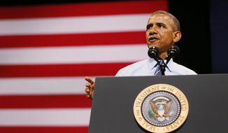 President Barack Obama speaks on the economy at the Paramount Theatre in Austin, Texas, Sunday, July 10, 2014. (AP Photo/The Dallas Morning News, Kye R. Lee, Pool)