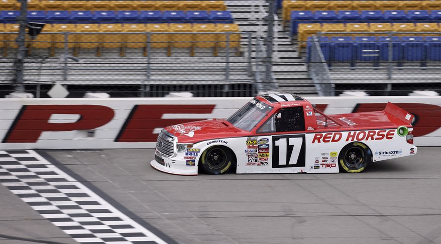 Timothy Peters drives his car during practice for the NASCAR Trucks Series auto race, Friday, July 11, 2014, at Iowa Speedway in Newton, Iowa. (AP Photo/Charlie Neibergall)