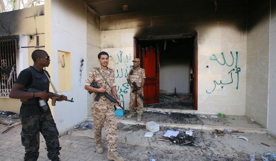 In this Sept. 14, 2012, file photo, Libyan military guards check one of the U.S. consulate&#x27;s burned buildings in Benghazi, after a deadly attack on Tuesday, Sept. 11, 2012, that killed four Americans. (AP Photo/Mohammad Hannon, File)