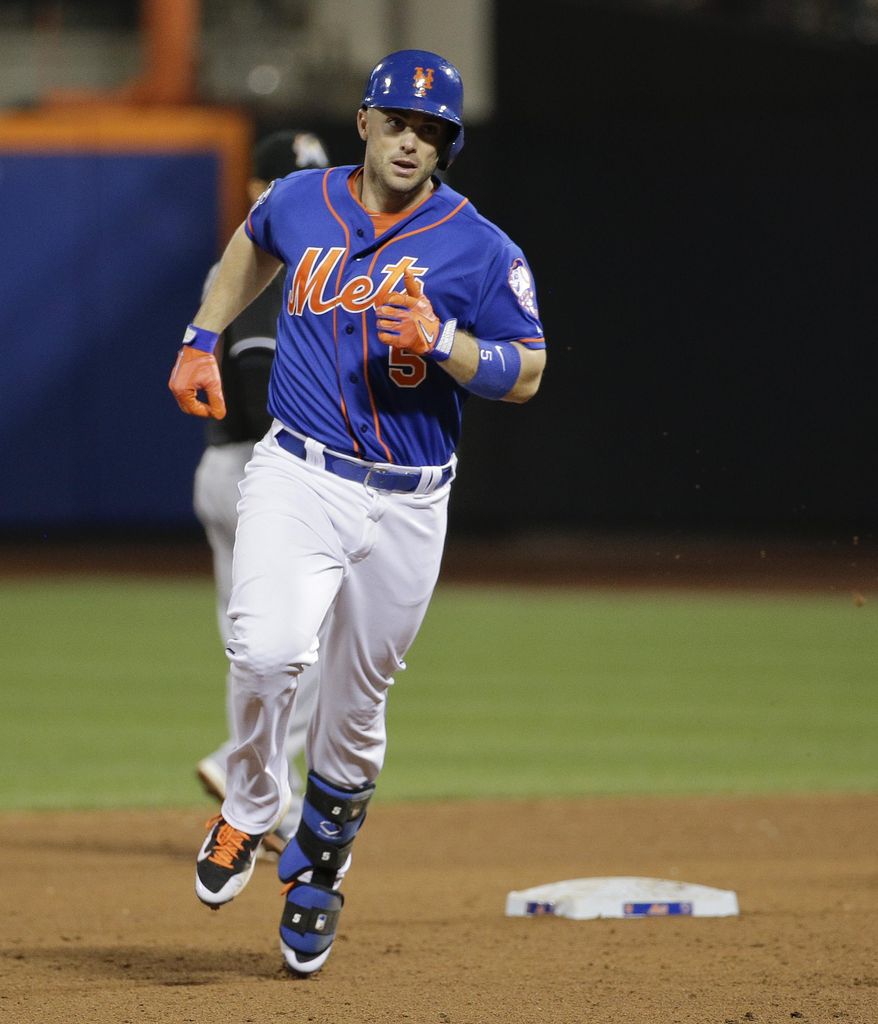 New York Mets' David Wright rounds the bases after hitting a two-run home run against the Miami Marlins in the fifth inning of a baseball game, Friday, July 11, 2014, in New York. Wright was 4 for 4 in the Mets' 7-1 win. (AP Photo/Julie Jacobson)