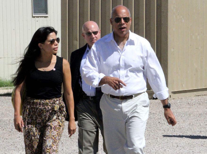 ** FILE ** Department of Homeland Security director Jeh Johnson, right, walks to a podium after finishing a tour of the Residential Detention Facility inside the Federal Law Enforcement Training Center in Artesia, N.M. on Friday, July 11, 2014. (AP Photo/Pool, El Paso Times, Rudy Gutierrez)