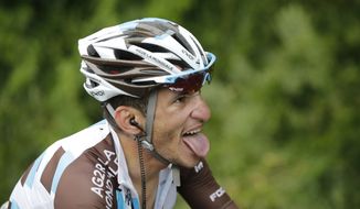 Stage winner France&#39;s Blel Kadri grimaces as he strains during the eighth stage of the Tour de France cycling race over 161 kilometers (100 miles) with start in Tomblaine and finish in Gerardmer, France, Saturday, July 12, 2014. (AP Photo/Christophe Ena)