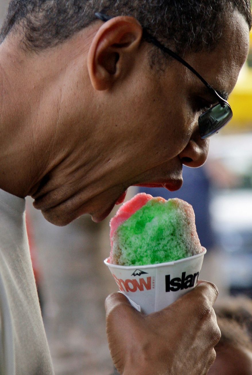 President Obama enjoys a shave ice at Island Snow in Kailua, Hawaii, where the Obamas spent the 2010 winter holidays. (Associated Press)