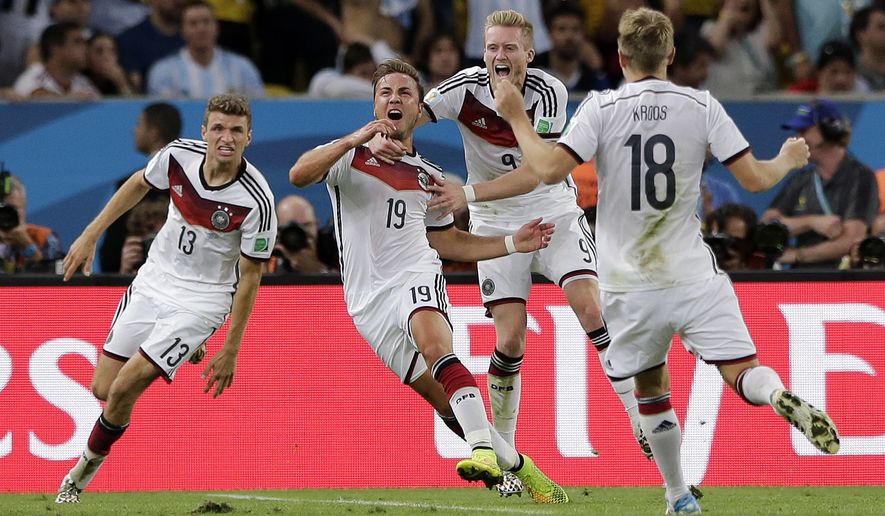 Germany&#39;s Mario Goetze (19) celebrates after scoring the opening goal during the World Cup final soccer match between Germany and Argentina at the Maracana Stadium in Rio de Janeiro, Brazil, Sunday, July 13, 2014.  (AP Photo/Matthias Schrader)