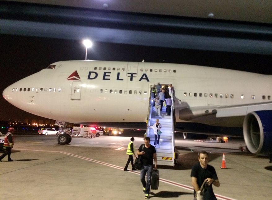 ** FILE ** In this photo provided by Michael Simon, a New York-bound Delta Air Lines plane is seen at Ben Gurion Airport in Tel Aviv, Israel, after an emergency Sunday, July 13, 2014. The flight returned safely to Tel Aviv about two hours after it left for John F. Kennedy International Airport in New York after flaps on the jumbo jet failed to retract properly on takeoff, the airline said. Delta spokeswoman Jennifer Martin said the crew made the emergency landing "out of an abundance of caution." (AP Photo/Michael Simon)