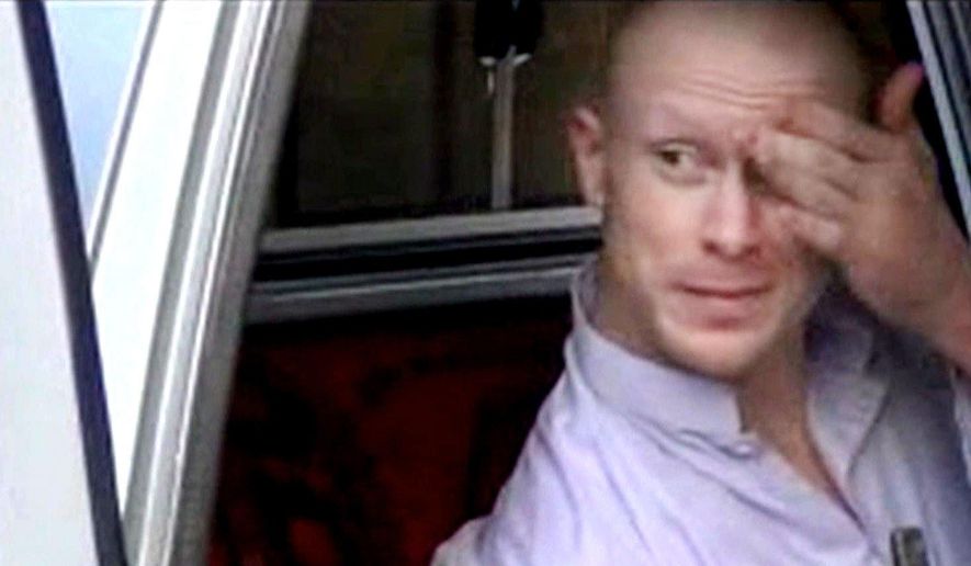 FILE - In this file image taken from video obtained from Voice Of Jihad Website, which has been authenticated based on its contents and other AP reporting, Sgt. Bowe Bergdahl, sits in a vehicle guarded by the Taliban in eastern Afghanistan.  A senior defense official says Bowe Bergdahl, the Army sergeant who spent nearly five years as a Taliban captive in Afghanistan, has been returned to regular Army duty. As of Monday he is assigned to U.S. Army North at Joint Base San Antonio-Fort Sam Houston in Texas. That is the same location where he has been decompressing from the effects of his lengthy captivity. (AP Photo/Voice Of Jihad Website via AP video, File)
