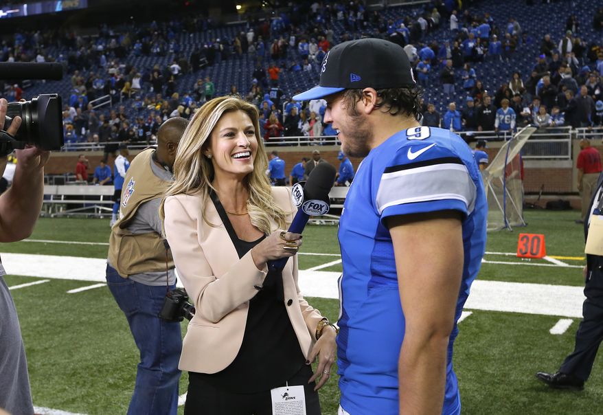 Fox Sports reporter Erin Andrews, left, interviews Detroit Lions quarterback Matthew Stafford after an NFL football game against the Green Bay Packers at Ford Field in Detroit, Thursday, Nov. 28, 2013. (AP Photo/Paul Sancya)