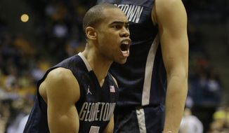 Georgetown&#39;s Markel Starks argues a call during the second half of an NCAA college basketball game against Marquette, Thursday, Feb. 27, 2014, in Milwaukee. (AP Photo/Jeffrey Phelps) 