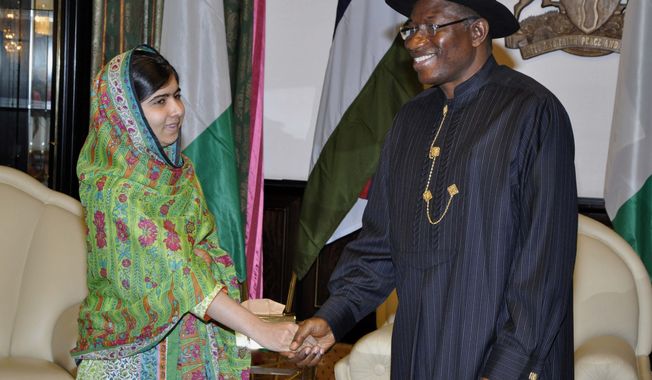 Pakistani activist Malala Yousafzai, left, shakes hands with Nigerian President, Goodluck Jonathan, right, at the Presidential villa, in Abuja, Nigeria, Monday, July 14, 2014. Yousafzai on Monday won a promise from Nigeria&#x27;s leader to meet with the parents of some of the 219 schoolgirls held by Islamic extremists for three months. Malala celebrated her 17th birthday on Monday in Nigeria with promises to work for the release of the girls from the Boko Haram movement. (AP Photo)