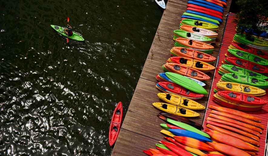 The popularity of kayaking and other outdoors sports help some cities recover from the recession. (Andrew Harnik/The Washington Times)