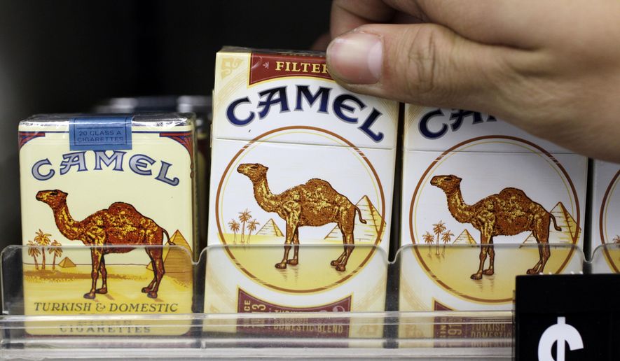Camel cigarettes, a Reynolds American product, are on display at a liquor store in Palo Alto, Calif., on Feb. 1, 2011. (Associated Press) **FILE**