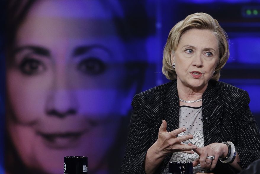 Former U.S. Secretary of State Hillary Rodham Clinton gestures while speaking to host Jon Stewart during a taping of "The Daily Show with Jon Stewart," Tuesday, July 15, 2014, in New York. (AP Photo/Frank Franklin II)