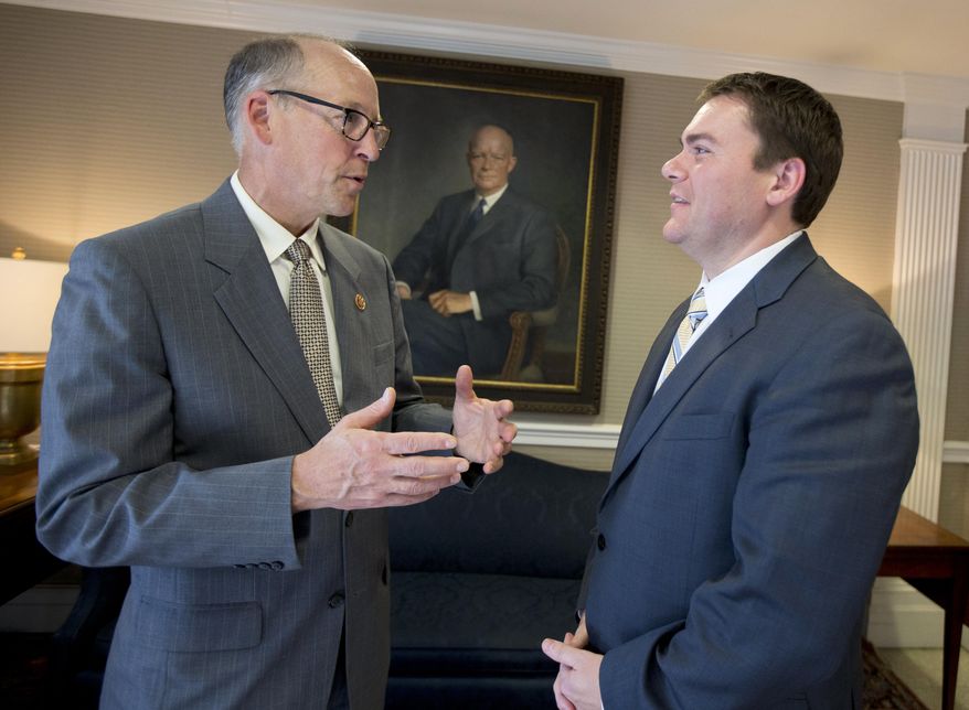 This photo taken on June 23, 2014, shows California Republican congressional candidate Carl DeMaio speaking to National Republican Congressional Committee (NRCC) Chairman Rep. Greg Walden, R-Ore., at the National Republican Club of Capitol Hill in Washington. DeMaio is one of three openly gay Republicans running for Congress this year, but he’s the only one who has managed to make political adversaries of both social conservative and gay rights organizations. (AP Photo/Manuel Balce Ceneta)