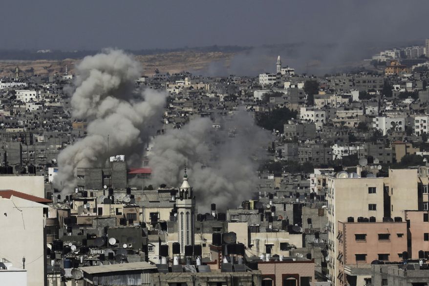 Smoke rises after Israeli missile strikes hit the northern Gaza Strip, Wednesday, July 16, 2014. Israeli war planes and naval vessels intensified attacks across the Gaza Strip on Wednesday, targeting senior Hamas leaders and bombarding a coastal area, where four Palestinian boys were killed. (AP Photo/Adel Hana)