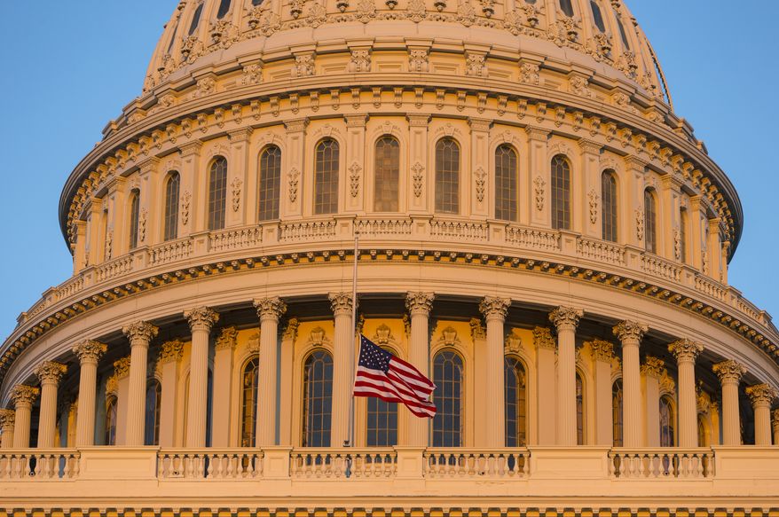 FILE - In this Sept. 16, 2013, file photo, the U.S. Capitol at sunset in Washington. Democrats and Republicans are fervently pursuing a batch of doomed bills in Congress because they target a coveted prize in the Nov. 4 elections: female voters. Wednesday, July 16's Senate vote on contraception legislation is the latest example of Democrats’ win-by-losing strategy, which forces Republicans to vote on sensitive matters that might rile women this fall. (AP Photo/J. Scott Applewhite, File)