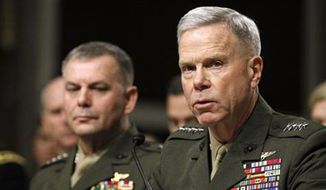 ** FILE ** Marine Corps Commandant Gen. James Amos, right, accompanied by Joint Chiefs Vice Chairman Marine Corps Gen. James Cartwright, testifies on Capitol Hill in Washington on Dec. 3, 2010. (Associated Press)