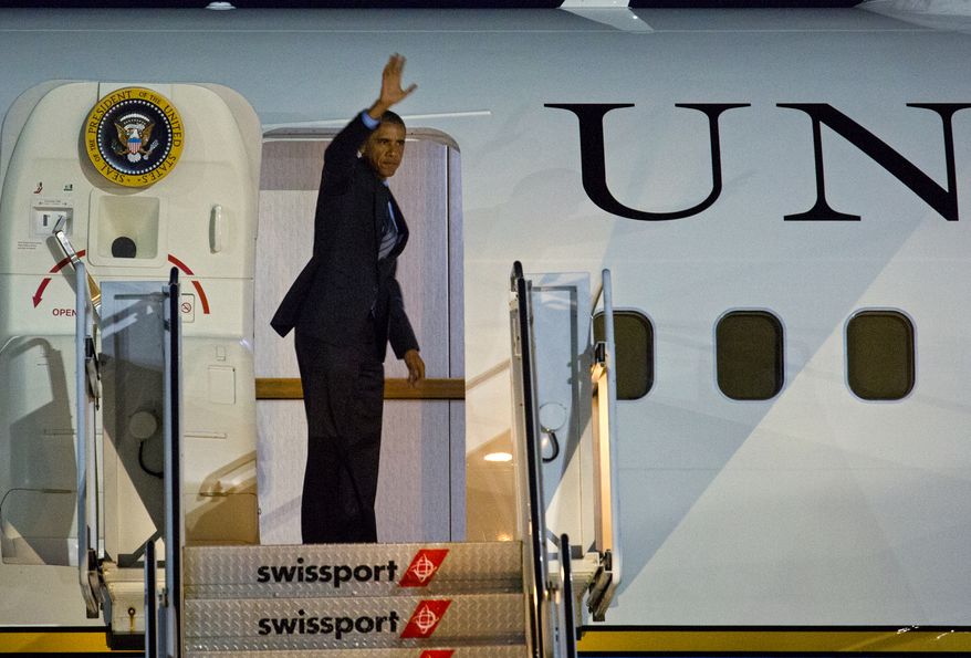 ** FILE ** President Barack Obama boards Air Force One at John F. Kennedy International Airport in New York, Thursday, July 17, 2014. Earlier he attended fundraising events in New York City. (AP Photo/Craig Ruttle)