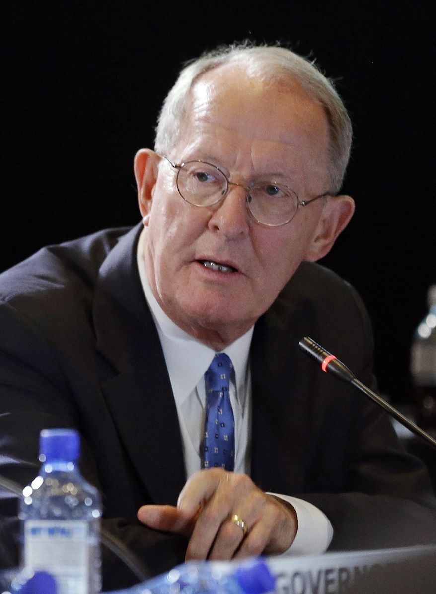 In this July 12, 2014 photo, Sen. Lamar Alexander, R-Tenn., takes part in a discussion at the National Governors Association convention in Nashville, Tenn. Early voting is getting underway for Tennessee's primary election that features tea party-styled challenges to Alexander's bid for the Republican nomination to a third term in the U.S. Senate. (AP Photo/Mark Humphrey)