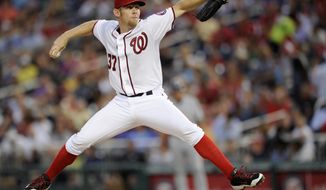 Washington Nationals starting pitcher Stephen Strasburg (37) delivers a pitch against the Milwaukee Brewers during the fourth inning of a baseball game, Friday, July 18, 2014, in Washington. (AP Photo/Nick Wass)