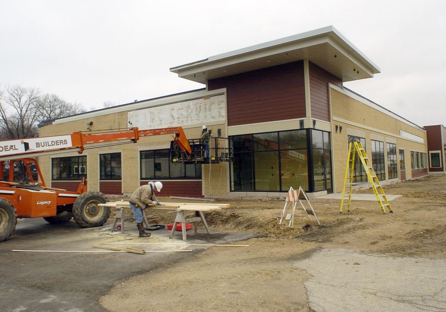 This March 28, 2014, photo, shows construction of a Domestic Abuse Intervention Services shelter in Madison, Wis. Domestic abuse shelters, often tucked away in the protective privacy of an obscure neighborhood, are moving out of the shadows with more public profiles aimed at generating more community support and better access for victims, according to advocacy leaders. (AP Photo/Taylor W. Anderson)