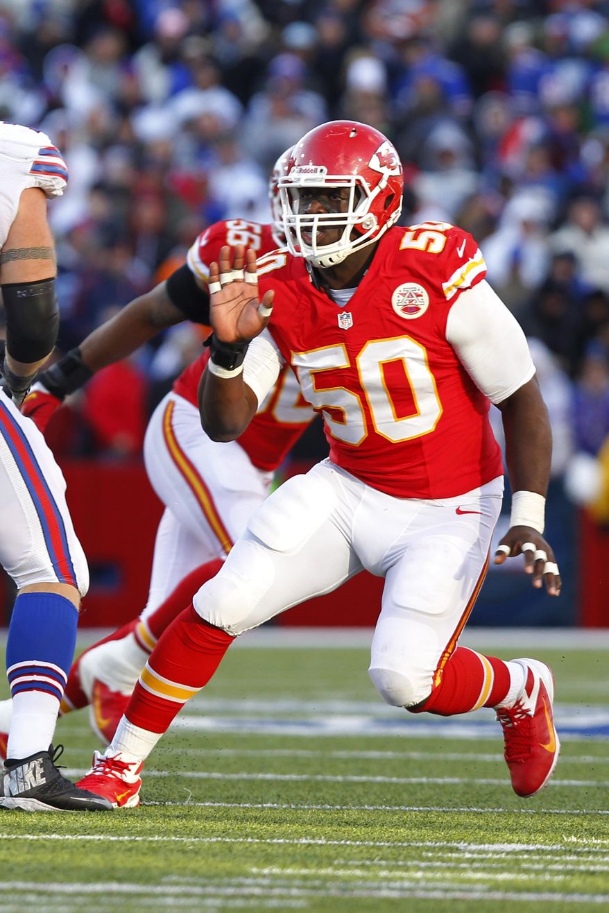 FILE - In this Nov. 3, 2013 file photo, Kansas City Chiefs outside linebacker Justin Houston (50) rushes during the fourth quarter of an NFL football game against the Buffalo Bills in Orchard Park, N.Y. The Pro Bowl linebacker is due to become a free agent next season and wants a new contract. The Chiefs would like to give it to him, too, but only if the price is right. (AP Photo/Bill Wippert)