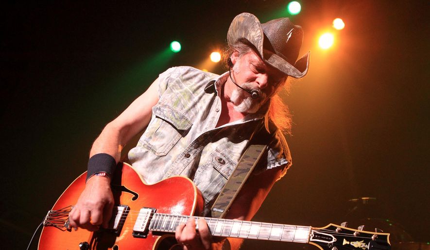 This Aug. 16, 2013, file photo shows Ted Nugent performing at Rams Head Live in Baltimore. (Photo by Owen Sweeney/Invision/AP, File)