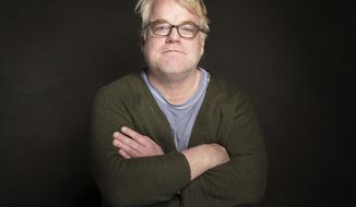 FILE - In a Jan. 19, 2014 file photo Phillip Seymour Hoffman poses for a portrait at The GenArt Quaker Good Energy Lodge Powered by CEG, during the Sundance Film Festival in Park City, Utah.  Court documents filed July 18, 2014 show Hoffman rejected his accountant&#39;s suggestion he set aside money for his three children because he didn&#39;t want them to be &amp;quot;trust fund&amp;quot; kids. (Photo by Victoria Will/Invision/AP)