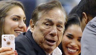 FILE - In this Oct. 25, 2013 file photo, Los Angeles Clippers owner Donald Sterling gestures as the Clippers play the Sacramento Kings during the first half of an NBA basketball game in Los Angeles. The future of the Clippers is closer to decision as testimony resumes Monday, July 21, 2014,  in a probate trial over whether a deal negotiated by Donald Sterling&#x27;s estranged wife to sell the team for $2 billion is authorized under a Sterling family trust. (AP Photo/Mark J. Terrill, File)