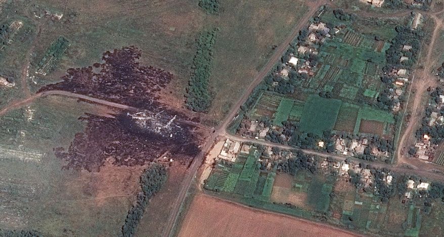 In this photo provided and dated Sunday, July 20, 2014 by Airbus DS/AllSource Analysis, a satellite image shows the primary crash site, at left, of Malaysia Airlines Flight 17 located near Hrabove, eastern Ukraine. Four days after Flight 17 was shot out of the sky, international investigators still have had only limited access to the crash site, hindered by the pro-Russia fighters who control the verdant territory in eastern Ukraine. (AP Photo/Airbus DS/AllSource Analysis) MANDATORY CREDIT