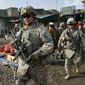 ** FILE ** U.S. soldiers patrol through Kabul, Afghanistan, in December, 2010. (Associated Press)
