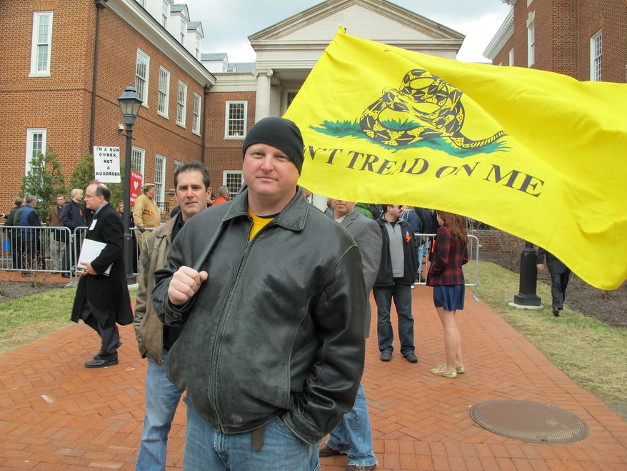 Doug Bigelow, of Hagerstown, Md., expresses his support for the right to bear arms on March 1, 2013, in Annapolis, where a gun-control measure that would ban assault weapons had a hearing. (Associated Press) ** FILE **