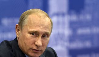 Russian President Vladimir Putin listens during a meeting in Samara, Russia, Monday, July 21, 2014. Putin has lambasted those who use the downing of a passenger jet in eastern Ukraine for &quot;mercenary objectives,&quot; the Kremlin said Monday. In a statement posted on the Kremlin website, Putin again lashed out at Ukraine for ongoing violence with pro-Russian rebels in the eastern part of the country. (AP Photo/RIA-Novosti, Alexei Nikolsky, Presidential Press Service)