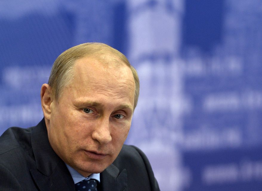 Russian President Vladimir Putin listens during a meeting in Samara, Russia, Monday, July 21, 2014. Putin has lambasted those who use the downing of a passenger jet in eastern Ukraine for "mercenary objectives," the Kremlin said Monday. In a statement posted on the Kremlin website, Putin again lashed out at Ukraine for ongoing violence with pro-Russian rebels in the eastern part of the country. (AP Photo/RIA-Novosti, Alexei Nikolsky, Presidential Press Service)