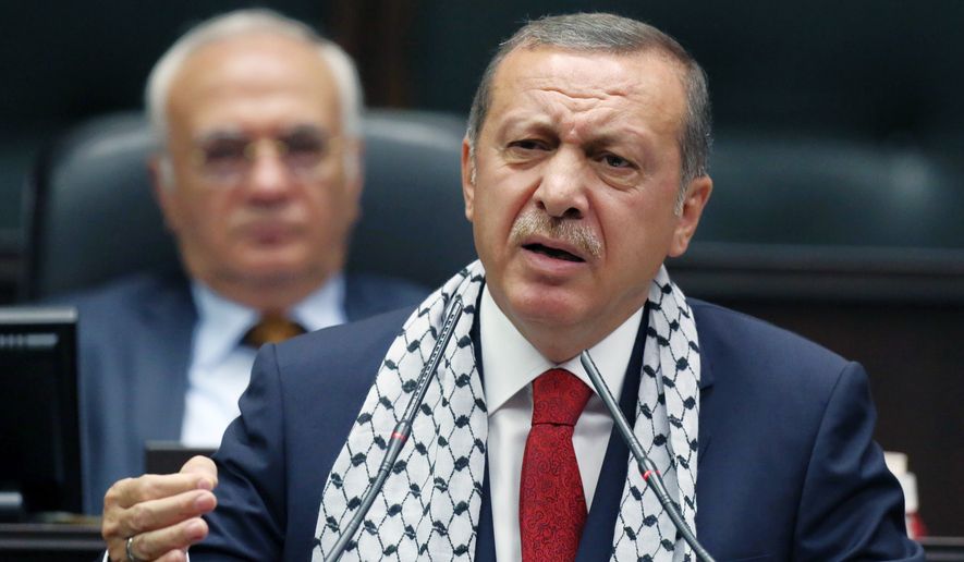 ** FILE ** Turkish Prime Minister Recep Tayyip Erdogan addresses his supporters at parliament in Ankara, Turkey, Tuesday, July 22, 2014. (AP Photo/Burhan Ozbilici)