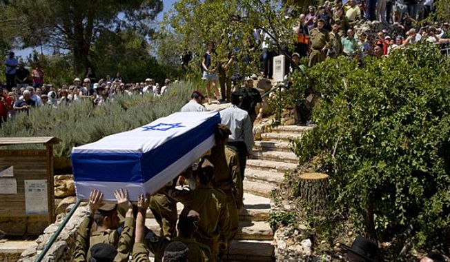 Israeli soldiers carry the coffin of Sgt. Max Steinberg during his funeral at the military cemetery in Jerusalem, Wednesday, July 23, 2014. (Associated Press)

