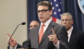 This July 21, 2014, file photo shows Gov. Rick Perry as he speaks during a news conference in the governor&#39;s press room, in Austin, Texas. (AP Photo/Eric Gay, File)