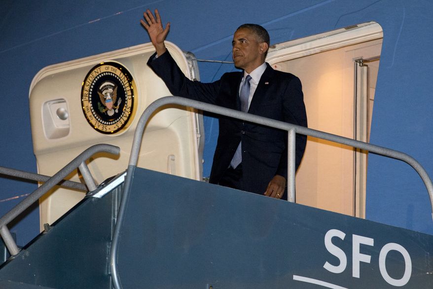 ** FILE ** President Barack Obama arrives in San Francisco, Tuesday, July 22, 2014, to continue a three-day West Coast trip that is planned to include at least five fundraising events in Seattle, San Francisco and Los Angeles. (AP Photo)