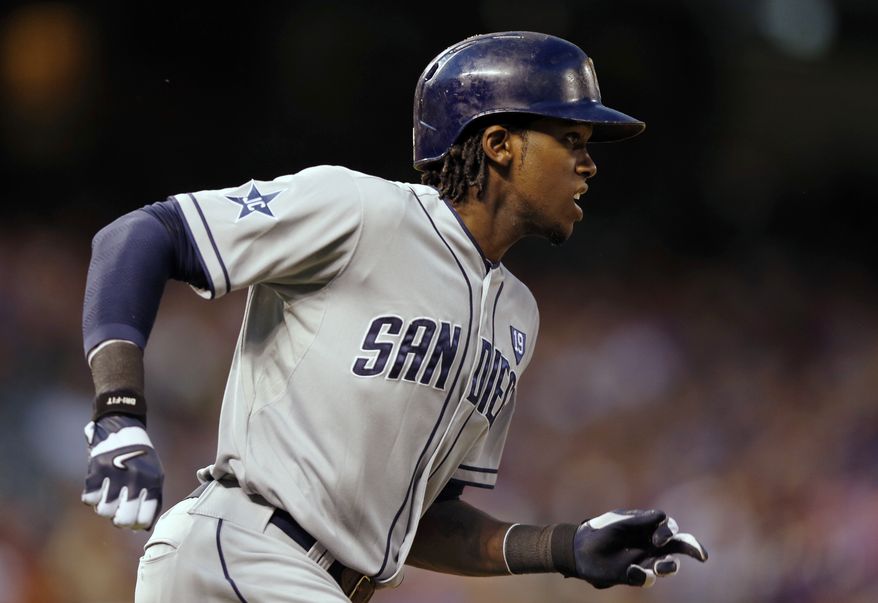 San Diego Padres&#39; Cameron Maybin runs out a ground rule RBI double against the Colorado Rockies during the sixth inning of an MLB baseball game on Monday, July 7, 2014, in Denver (AP Photo/Jack Dempsey)