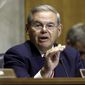 FILE - In this July 17, 2014, file photo,. Senate Foreign Relations Chairman Robert Menendez, D-N.J., gestures as she speaks on Capitol Hill in Washington. Menendez threatened Thursday, July 24, to block U.S. arms sales to Iraq if Congress doesn&#x27;t get an assessment of Iraqi forces and assurances the weapons won&#x27;t fall into the hands of extremist militants.(AP Photo/J. Scott Applewhite, File)
