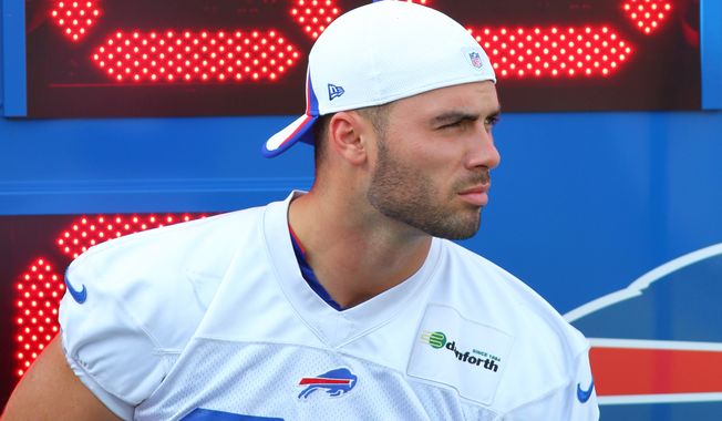 Buffalo Bills Mike Caussin (80) watches the action during their NFL football training camp in Pittsford, N.Y., Monday, Aug. 5, 2013. (AP Photo/Bill Wippert)
