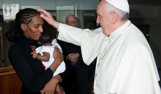 In this photo provided by the Vatican newspaper L&#39;Osservatore Romano, Pope Francis meets Meriam Ibrahim, from Sudan, with her daughter Maya in her arms,  in his Santa Marta residence, at the Vatican, Thursday, July 24, 2014.   The Sudanese woman who was sentenced to death in Sudan for refusing to recant her Christian faith has arrived in Italy along with her family, including the infant born in prison.  Ibrahim, whose father was Muslim but whose mother was an Orthodox Christian from Ethiopia, was sentenced to death over charges of apostasy. She married her husband, a Christian, in a church ceremony in 2011.  (AP Photo/L&#39;Osservatore Romano, File)