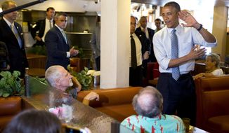 President Barack Obama talks about his basketball game with a customer at Canter&#39;s Deli in Los Angeles, Thursday, July 24, 2014, where he made a surprise appearance on the final day of his three-day West Coast trip. (AP Photo)