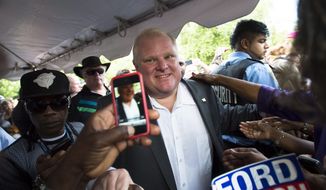 Mayor Rob Ford greets supporters at a party called &quot;Ford Fest&quot; organized by his family in Toronto on Friday, July 25, 2014. Ford returned to City Hall on July 1 after completing two months in rehab for substance abuse. (AP Photo/The Canadian Press, Darren Calabrese)