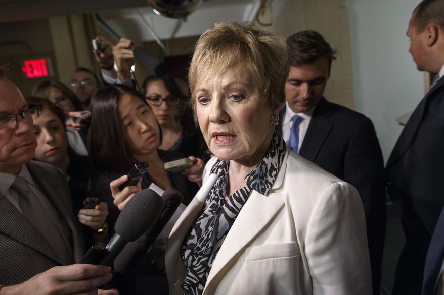 Rep. Kay Granger, R-Texas, is surrounded by reporters on Capitol Hill in Washington, Friday, July 25, 2014, as she emerges from a closed-door session with fellow Republicans. President Barack Obama will urge Central American leaders to help slow the influx of unaccompanied children fleeing their countries for the United States, even as Congress remains deeply divided over proposals to stem the crisis at the border.   (AP Photo)