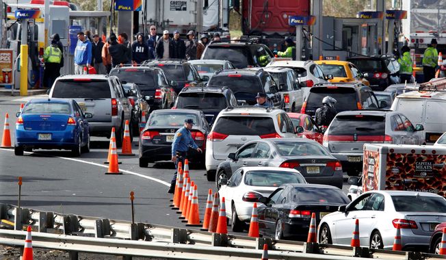 New Jersey state troopers kept order as motorists and pedestrians waited in long lines to purchase gasoline in the paucity following Superstorm Sandy. The storm&#x27;s fallout highlighted the need for increased domestic oil reserves. (associated press)